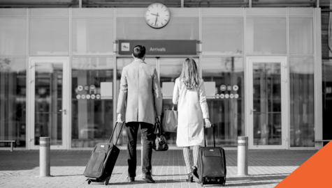 2 people walking into airport